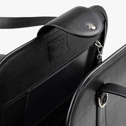 Close-up of NOTCOMMON STUDIO's Companion Tote Bag, showcasing its sleek black recycled leather, detailed craftsmanship, and custom hardware accents.